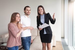 landlord showing the apartment to prospective tenants